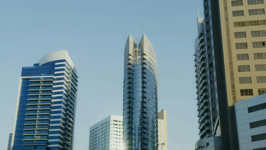 a group of tall buildings sitting next to each other, hurufiyya, exterior shot, exterior photo