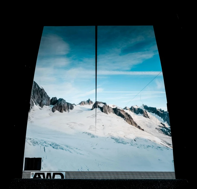 a view of a snow covered mountain through a window, video art, opposite the lift-shaft, symmetrical image, epic ultrawide shot, panel of black