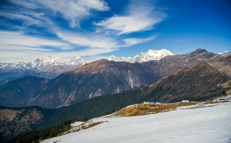 a person standing on top of a snow covered mountain, by Joseph Severn, pexels contest winner, uttarakhand, panorama distant view, slide show, promo image