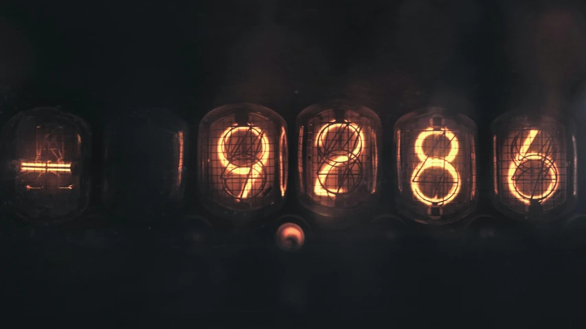 a close up of a light bulb with numbers on it, an album cover, unsplash, retrofuturism, clocks, 1 9 3 8 photo, neon electronic signs, the year 2089