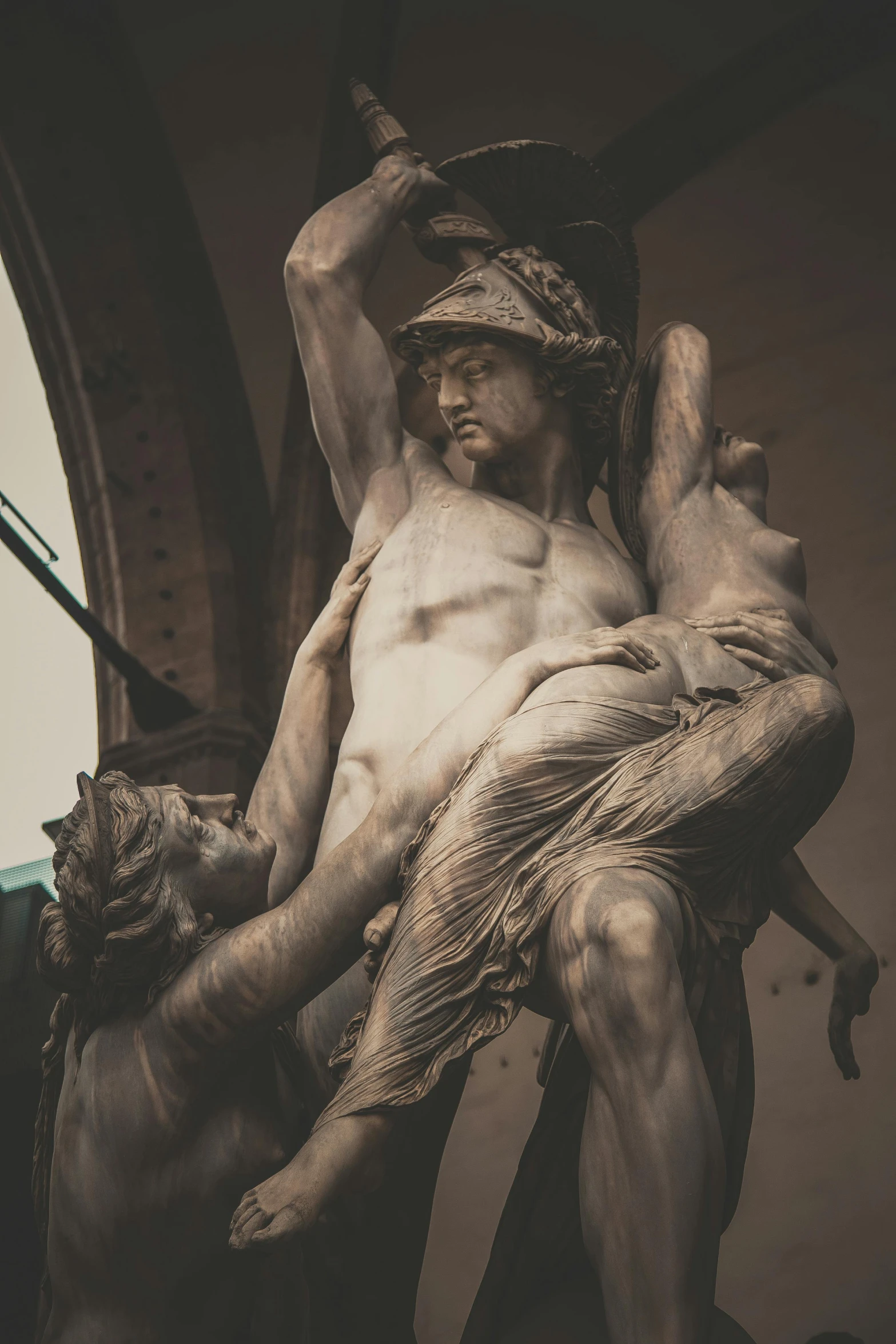 a black and white photo of a statue, a statue, inspired by Michaelangelo, pexels contest winner, cool sepia tone colors, fauns, close-up fight, made of marble