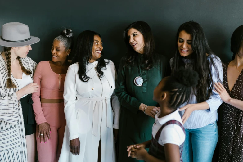 a group of women standing next to each other, by Emma Andijewska, pexels contest winner, hurufiyya, photo of sheryl sandberg, essence, family friendly, promo image