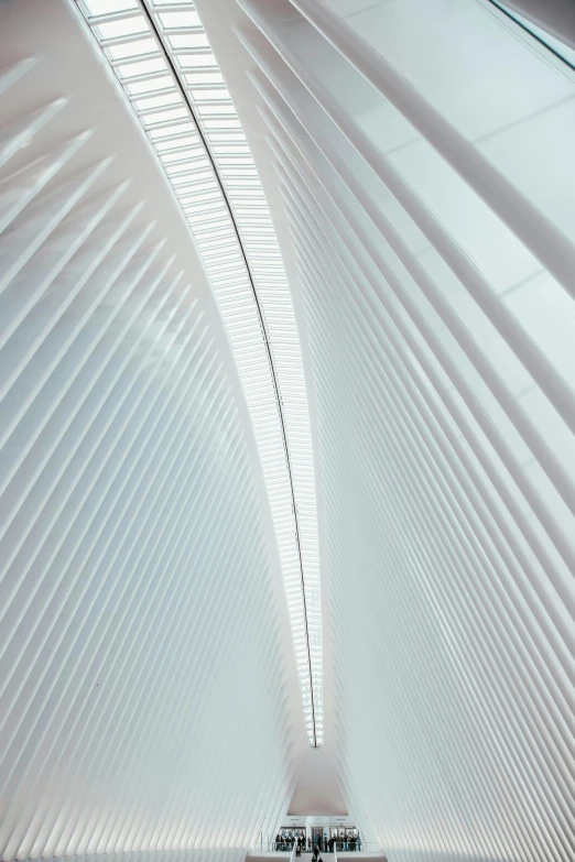 a couple of people that are standing in a building, inspired by Zaha Hadid, pexels contest winner, light and space, cables hanging, calatrava, tent architecture, square lines