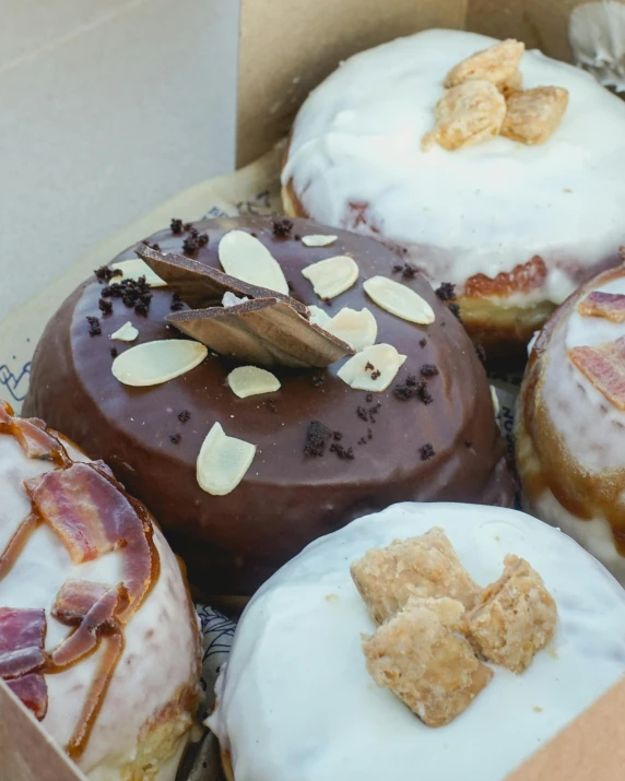 a box filled with lots of different kinds of doughnuts, a portrait, unsplash, “ iron bark, burnt, round-cropped, milk