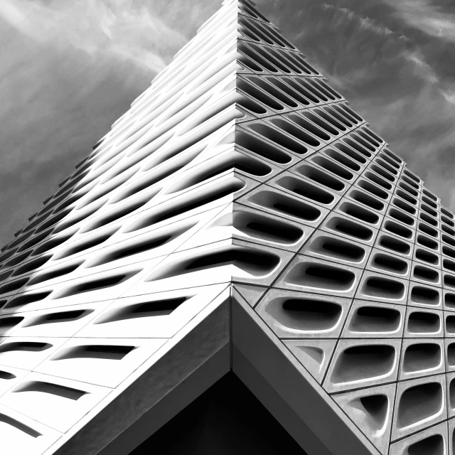 a black and white photo of a tall building, by Matthias Weischer, unsplash contest winner, op art, los angeles 2 0 1 5, intricate triangular designs, 3d printed building, square