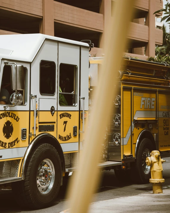 a fire truck parked next to a fire hydrant, pexels contest winner, white and yellow scheme, 🚿🗝📝, profile image, parade floats