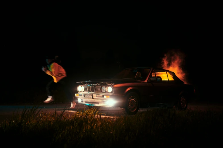 a person jumping in the air next to a car, an album cover, inspired by Mike Winkelmann, pexels contest winner, auto-destructive art, bmw e 3 0, glowing in the dark, fires!! hyperrealistic, running lights