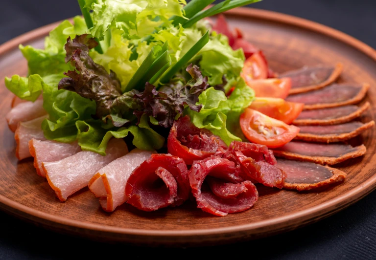 a close up of a plate of food on a table, on a wooden plate, bacon lettuce and tomatos, thumbnail, shogakukan