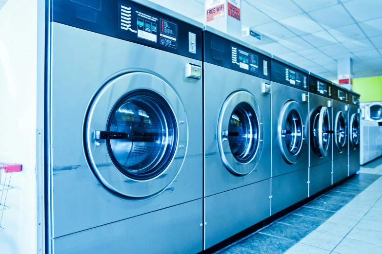 a row of washing machines sitting next to each other, by Julia Pishtar, profile image, commercial photo, premium quality, glittering