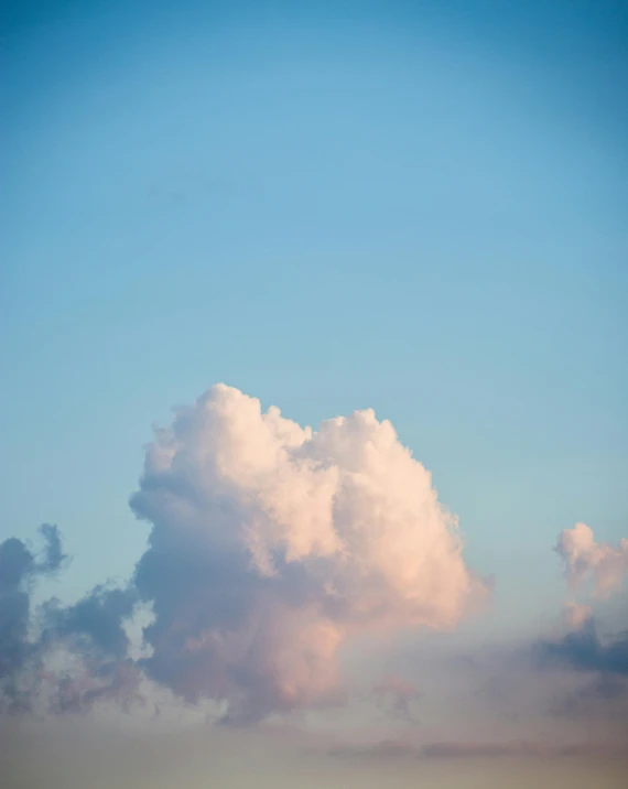 a couple of people on a beach flying a kite, unsplash, romanticism, layered stratocumulus clouds, made of cotton candy, landscape photo, cumulus cloud tattoos