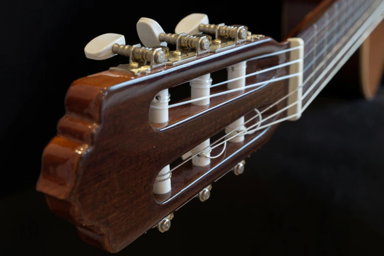 a close up of a guitar on a black background, by David Simpson, unsplash, arabesque, detailed model, 3/4 view realistic, portrait n - 9, cutaway