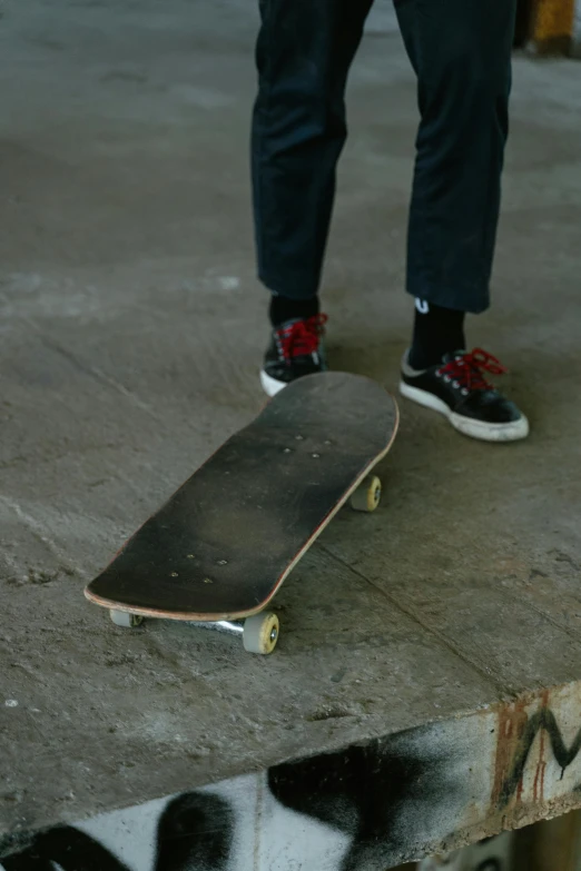 a person standing on top of a skateboard, small nose, plain, rollerbladers, lane brown