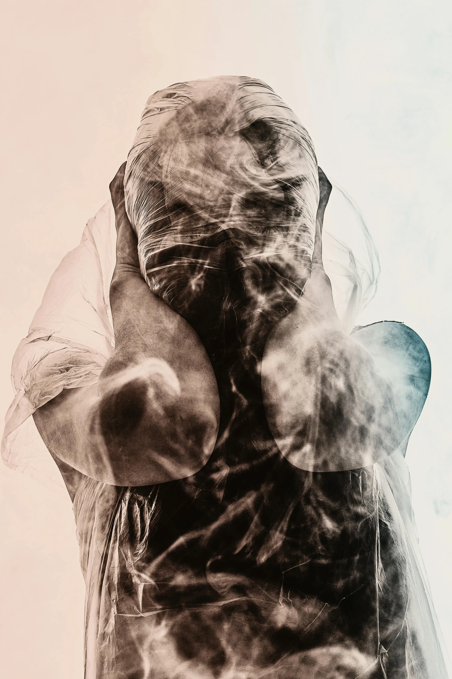 a black and white photo of a person covered in smoke, poster art, unsplash, art photography, photochrom print, clenched fists, hooded figure, x-ray photography