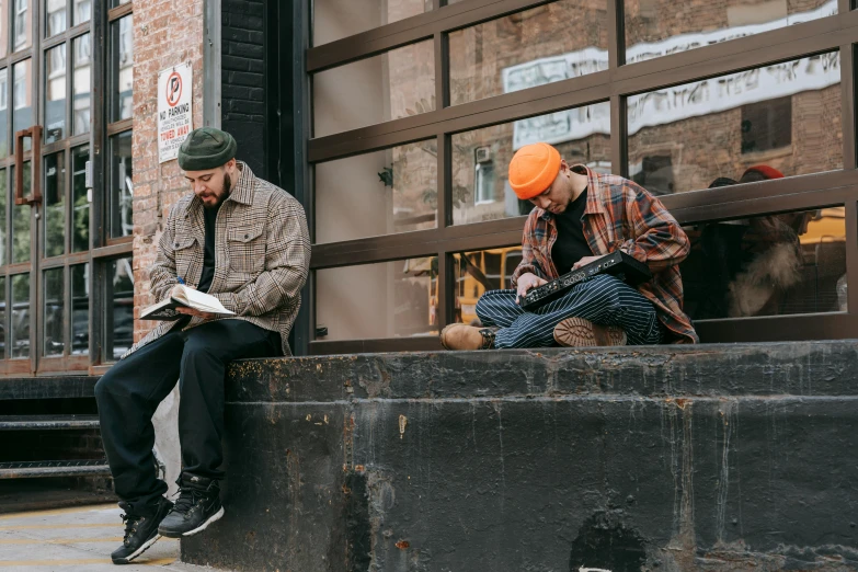 a couple of men sitting on the side of a building, pexels contest winner, visual art, drawing sketches on his notebook, action bronson, small hipster coffee shop, worksafe. instagram photo