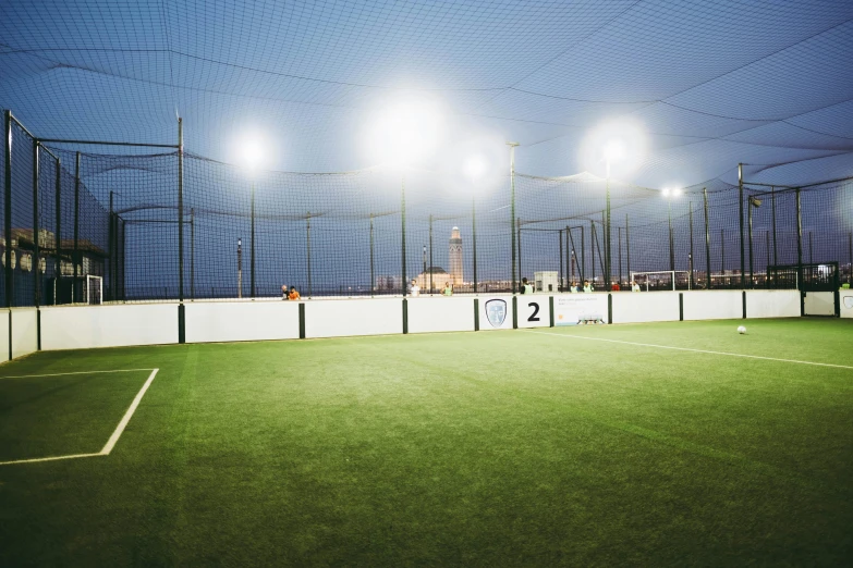 a group of people playing a game of tennis, by karlkka, unsplash, conceptual art, led floodlights, on a football field, seaview, hexagonal shaped