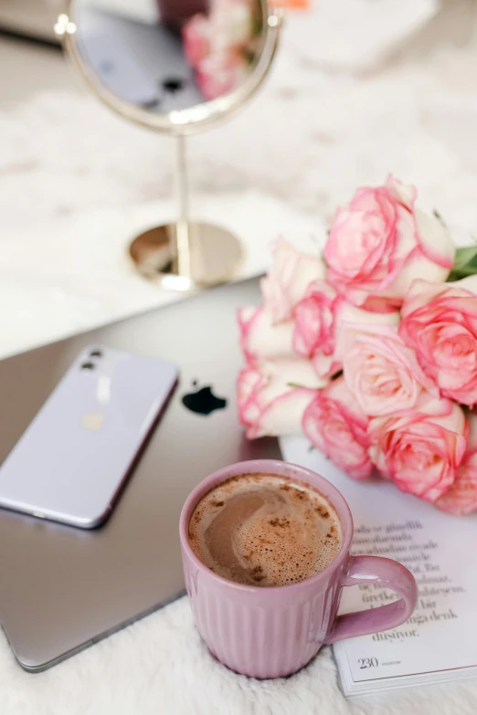 a laptop computer sitting on top of a table next to a cup of coffee, by Julia Pishtar, trending on pexels, romanticism, pastel roses, smartphone photo, milk and mocha style, ((pink))