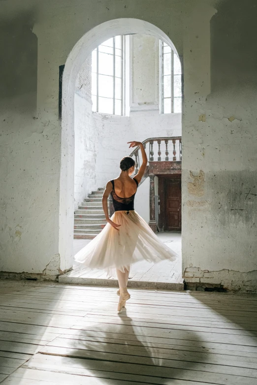 a woman that is standing in a room, inspired by Anka Zhuravleva, unsplash contest winner, arabesque, wearing a tutu, in a castle, half - turn, getty images proshot
