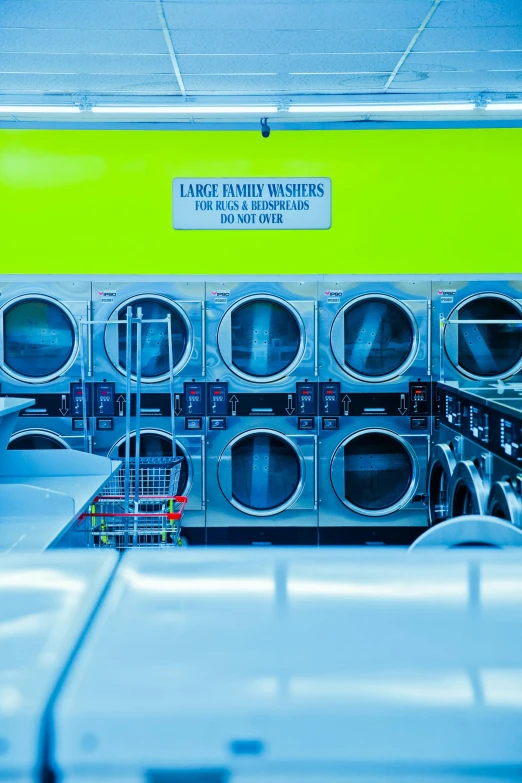 a row of industrial washing machines in a laundry room, a silk screen, by Doug Ohlson, pexels contest winner, lime green, thumbnail, bright neon, 2 0 5 6