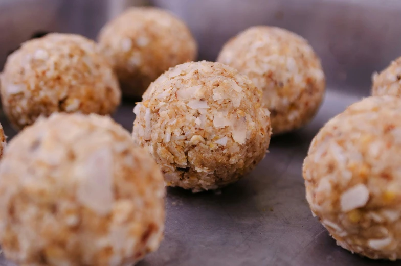 a close up of a bunch of balls of food, slightly turned to the right, nut, cooked, thumbnail