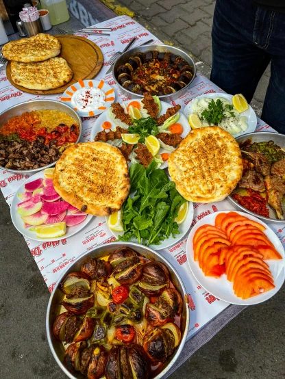 a table topped with lots of different types of food, dau-al-set, georgic, high quality picture, square, multicoloured