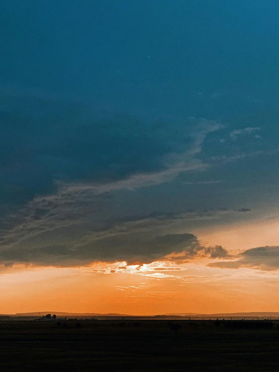 a person riding a horse in a field at sunset, by Adam Marczyński, unsplash contest winner, minimalism, panorama view of the sky, background image, humid evening, blue and orange