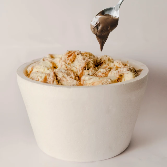 a close up of a bowl of food with a spoon, a marble sculpture, by Ryan Pancoast, gradient brown to white, eating ice cream, gif, overflowing