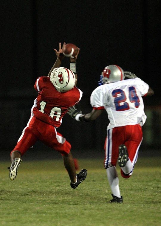 a football player catching a ball during a game, by Terrell James, flickr, in louisiana, getty images, high school, embarrassing