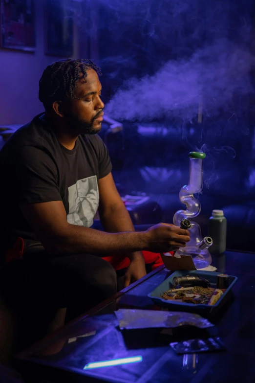 a man sitting on a couch smoking a cigarette, a portrait, featured on reddit, black light, water pipe, high quality upload, smokey cannons