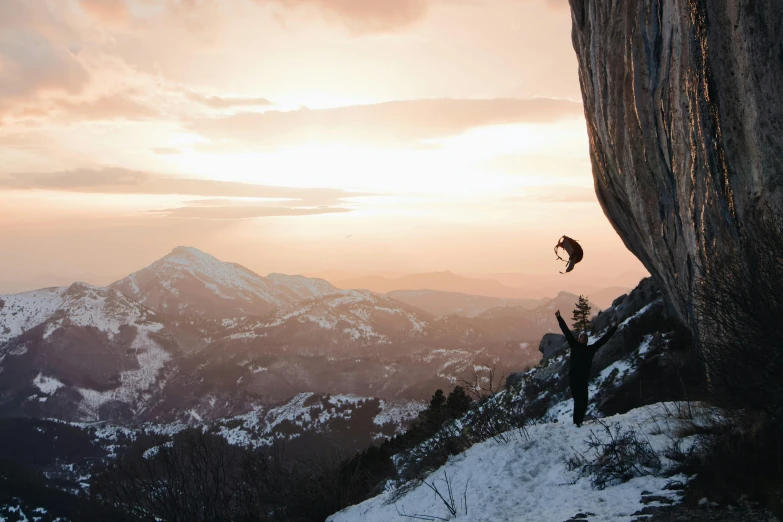 a man flying through the air while riding a snowboard, inspired by Michael Komarck, unsplash contest winner, rock climbers climbing a rock, 2 0 2 1 cinematic 4 k framegrab, perfectly lit. movie still, environments )