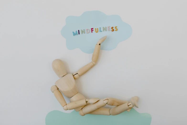 a wooden mannequin sitting on a cloud with the word mindfulness written on it, a picture, full product shot, mint, fully posable, wall art