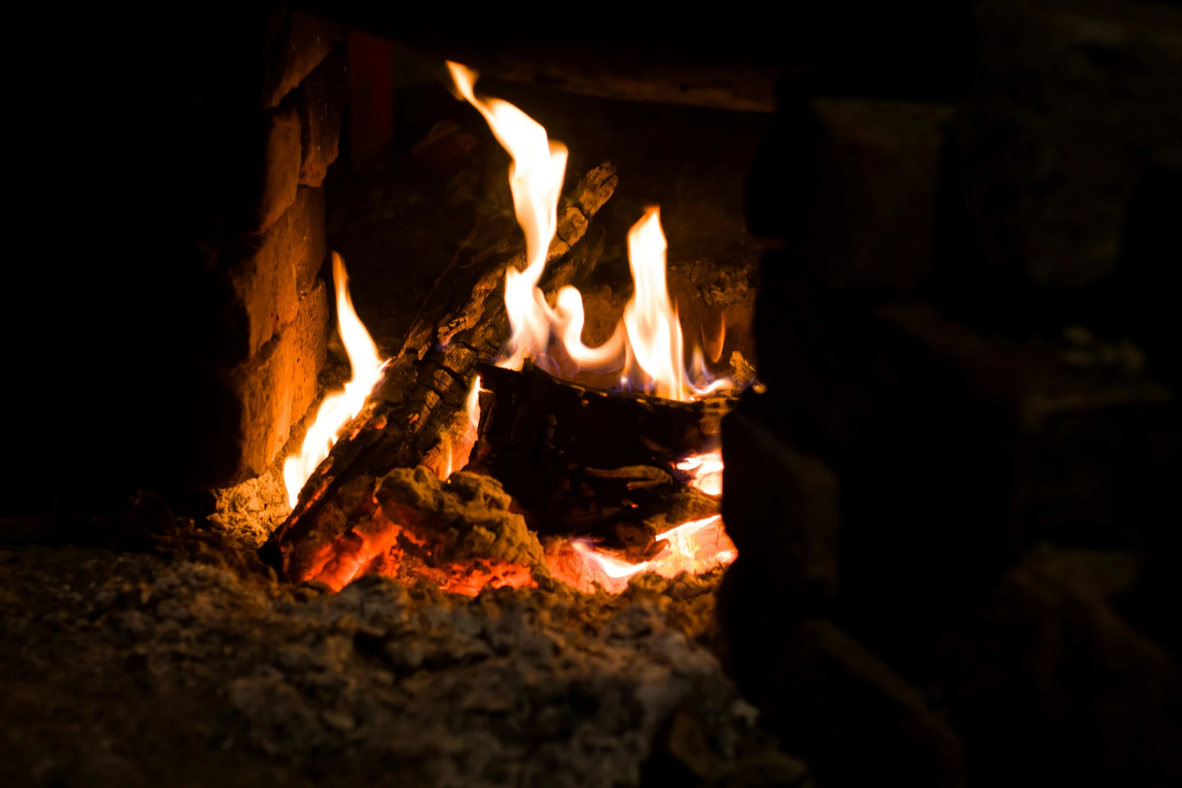 a close up of a fire in a fireplace, pexels contest winner, light inside the hut, brown, thumbnail, profile image