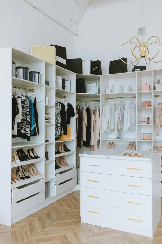 a closet filled with lots of clothes and shoes, featured on instagram, white marble with gold accents, full room view, profile image, detailed product shot