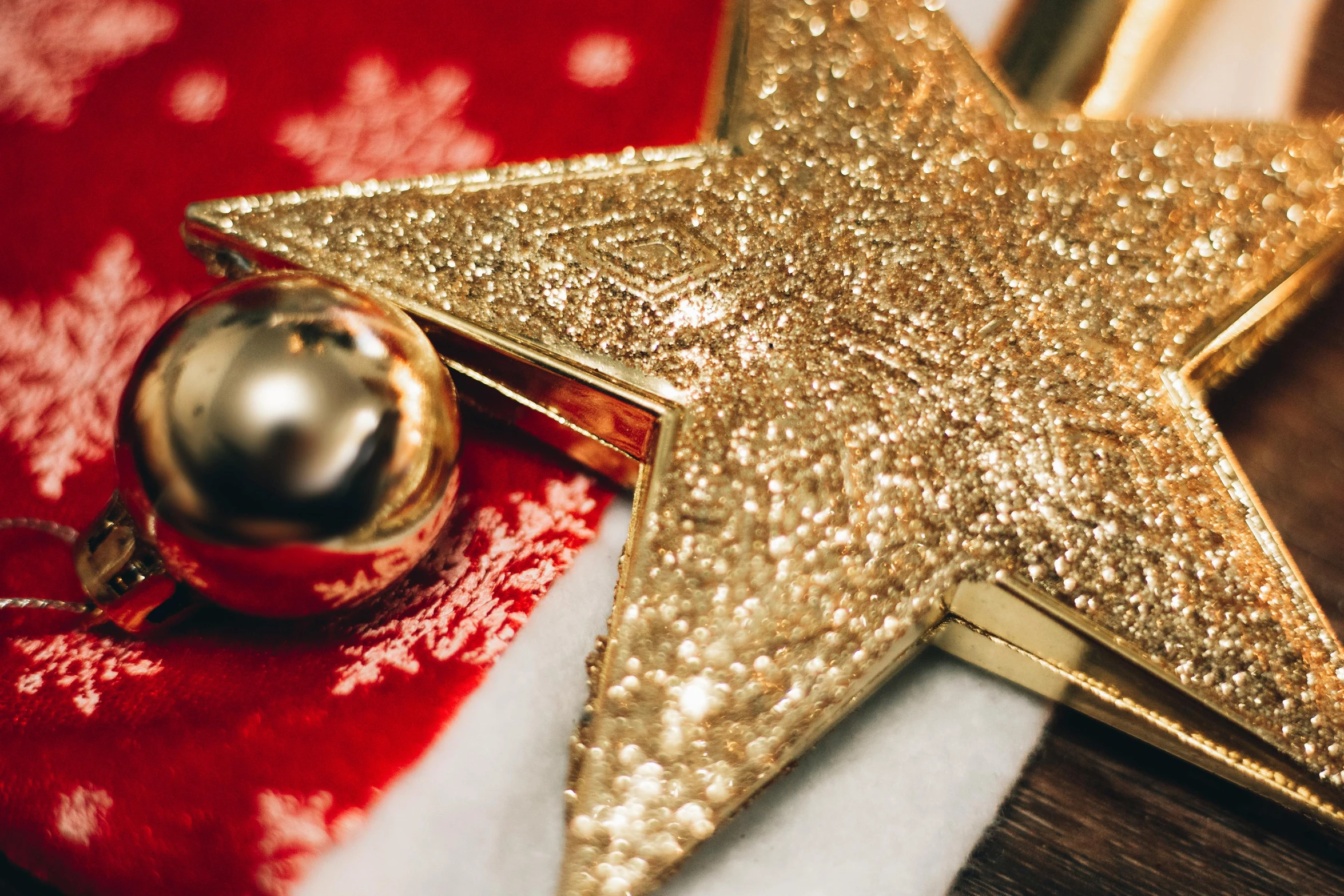 a gold star sitting on top of a red blanket, decorations, profile image, flatlay, wearing festive clothing