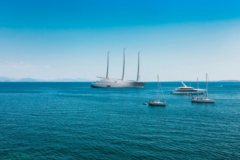 a group of boats floating on top of a body of water, a digital rendering, by Giuseppe Avanzi, pexels contest winner, renaissance, on a super yacht, santiago calatrava, shot from afar, three masts