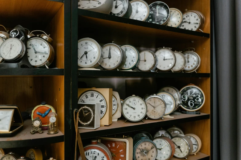 a shelf filled with lots of different types of clocks, a portrait, trending on pexels, 🦩🪐🐞👩🏻🦳, bedhead, tim rees, countdown