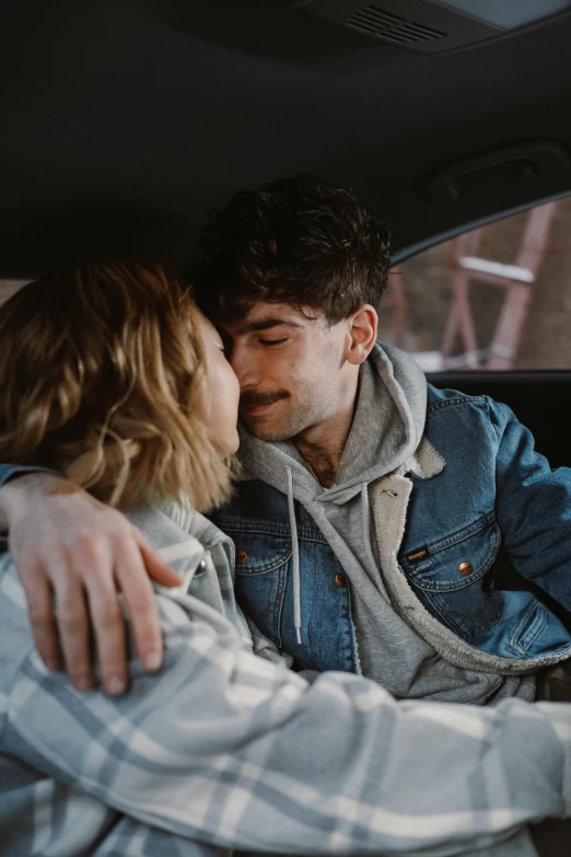 a man and woman sitting in the back seat of a car, by Adam Dario Keel, hugging, adam ondra, gen z, soft texture