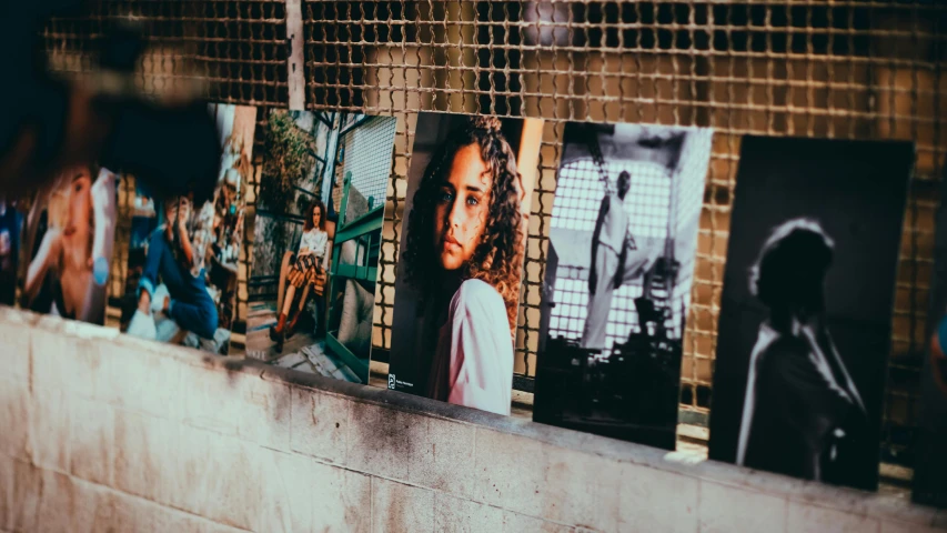 a bunch of pictures that are on a wall, pexels contest winner, imaan hammam, location ( favela ), metal plate photograph, 90's photo