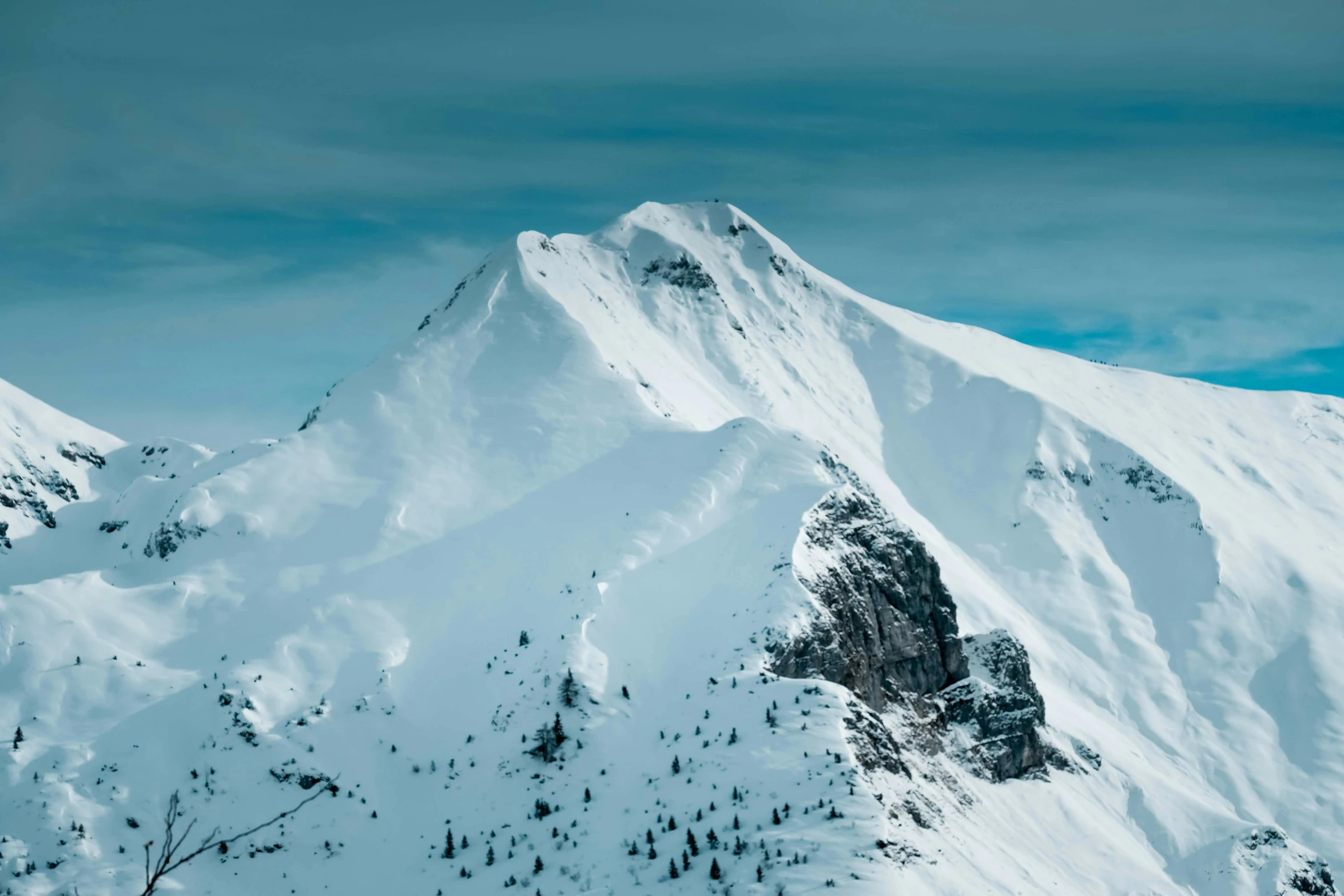 a man standing on top of a snow covered mountain, pexels contest winner, “ aerial view of a mountain, whistler, detailed high resolution, multiple stories