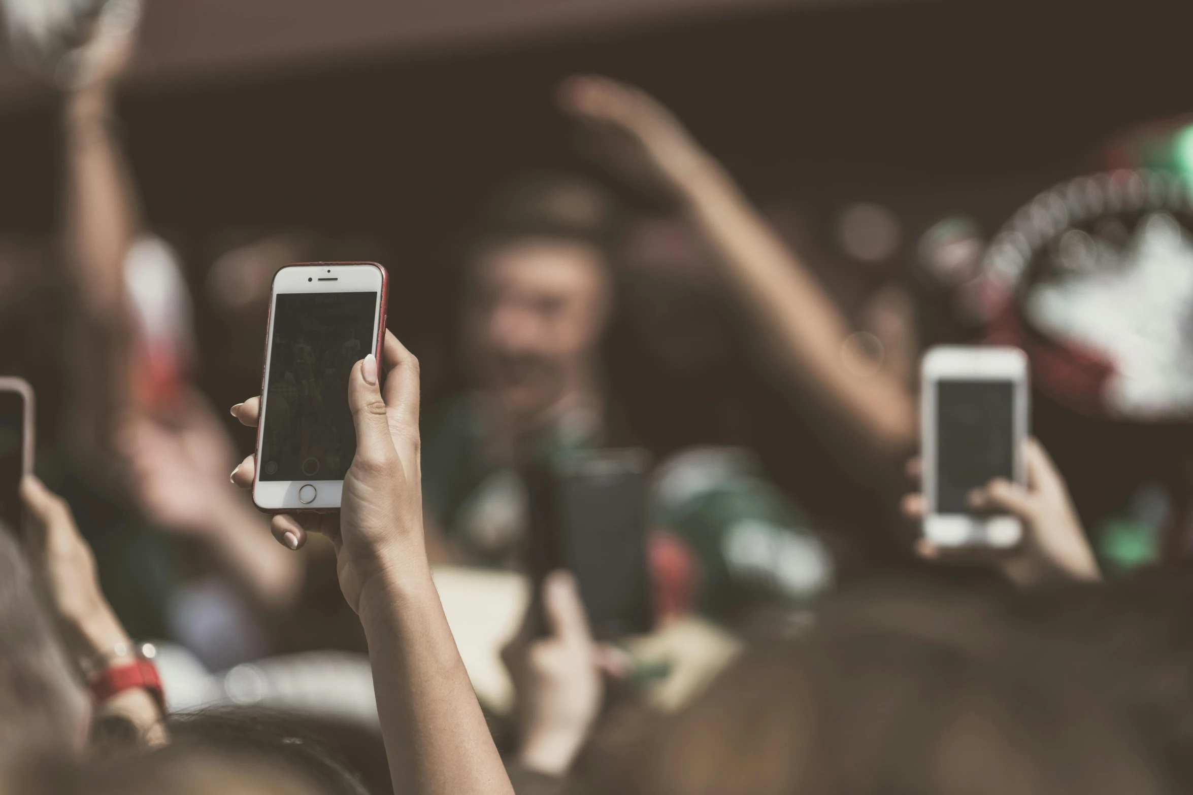 a group of people taking pictures with their cell phones, by Adam Marczyński, trending on pexels, faded worn, fans, half image, audience