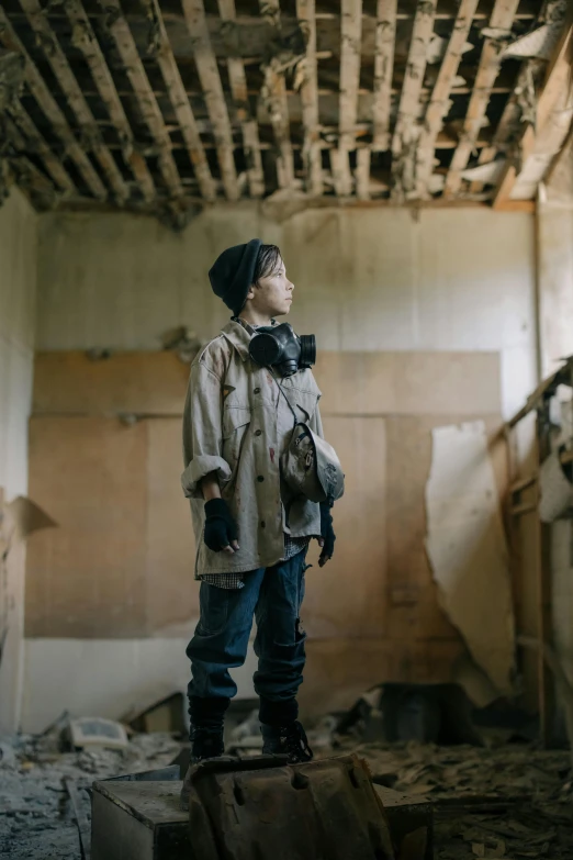 a little boy that is standing in a room, inspired by ashley wood, unsplash, visual art, postapocalyptic style, photograph of a techwear woman, film still from the movie, greta thunberg