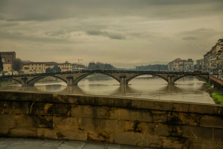 a bridge over a river with buildings in the background, by Alessandro Allori, pexels contest winner, renaissance, overcast day, old color photograph, arches, leonardo da vinci)