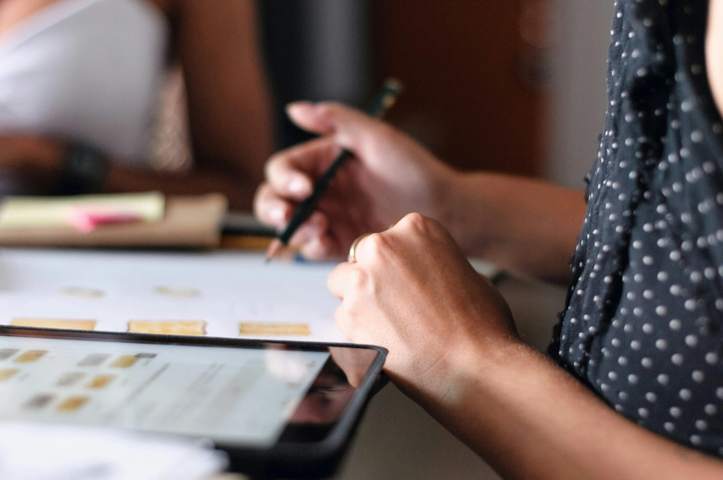 a person sitting at a table with a tablet, by Carey Morris, trending on pexels, holding pencil, people at work, very detaile, avatar image