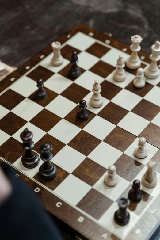 a person playing a game of chess on a table, square, taken in 2 0 2 0, thumbnail, charts