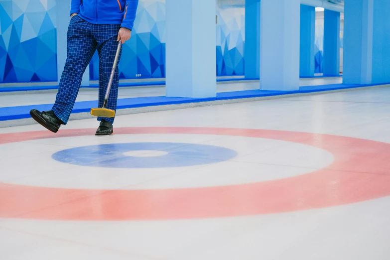 a man in a blue jacket holding a curling stick, by Julia Pishtar, pexels contest winner, rectangle, white, swirls, commercial