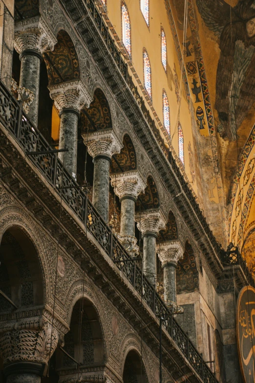 the inside of a building with columns and arches, a mosaic, pexels contest winner, romanesque, golden orbs, the fall of constantinople, crenellated balconies, scene from supplizia