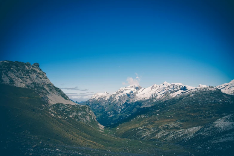 a view of a mountain range with a lake in the foreground, pexels contest winner, les nabis, the middle of a valley, blue glacier, brown, swiss alps