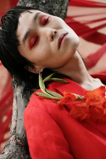 a man laying in a hammock next to a tree, an album cover, inspired by Taro Yamamoto, trending on pexels, romanticism, their irises are red, portrait androgynous girl, wearing a red cheongsam, photo of a rose