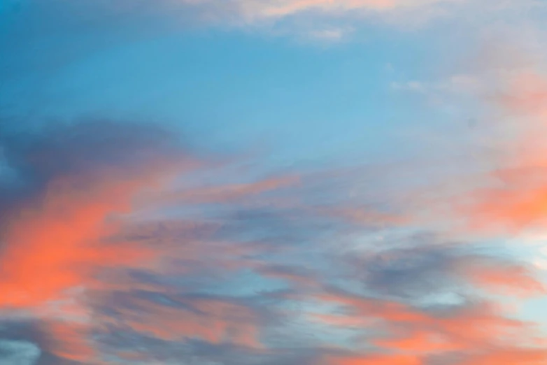 a man riding a snowboard on top of a snow covered slope, an album cover, by Jan Rustem, unsplash, romanticism, pink clouds in the sky, sunset panorama, sky blue, soft light - n 9