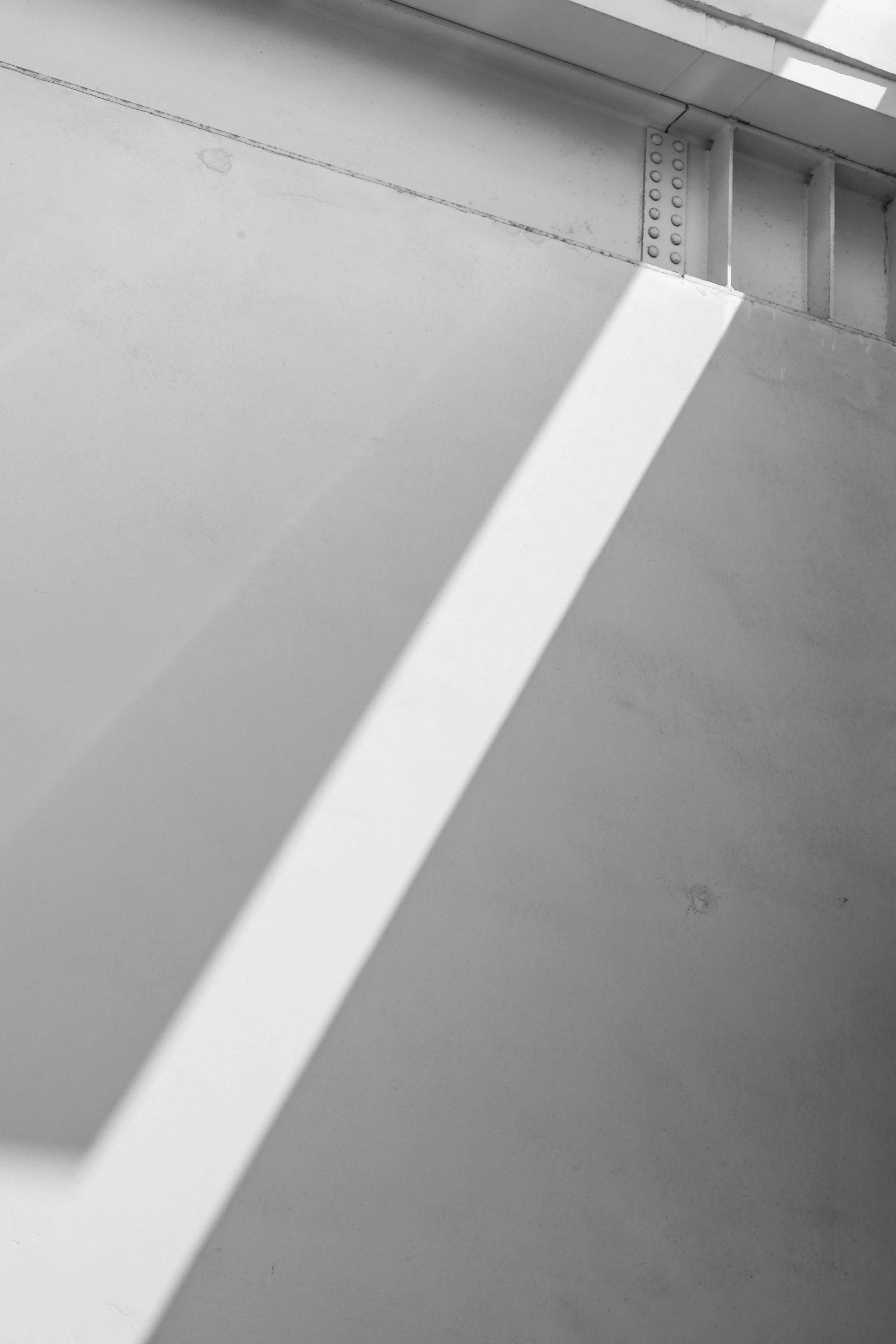 a man riding a skateboard up the side of a ramp, a black and white photo, inspired by Ryoji Ikeda, unsplash, postminimalism, abstract detail, dan flavin, white plastic, [ metal ]