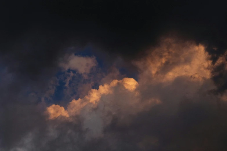 a jetliner flying through a cloudy sky, an album cover, unsplash, minimalism, dark mammatus cloud, evening lighting, low angle 8k hd nature photo, ignant